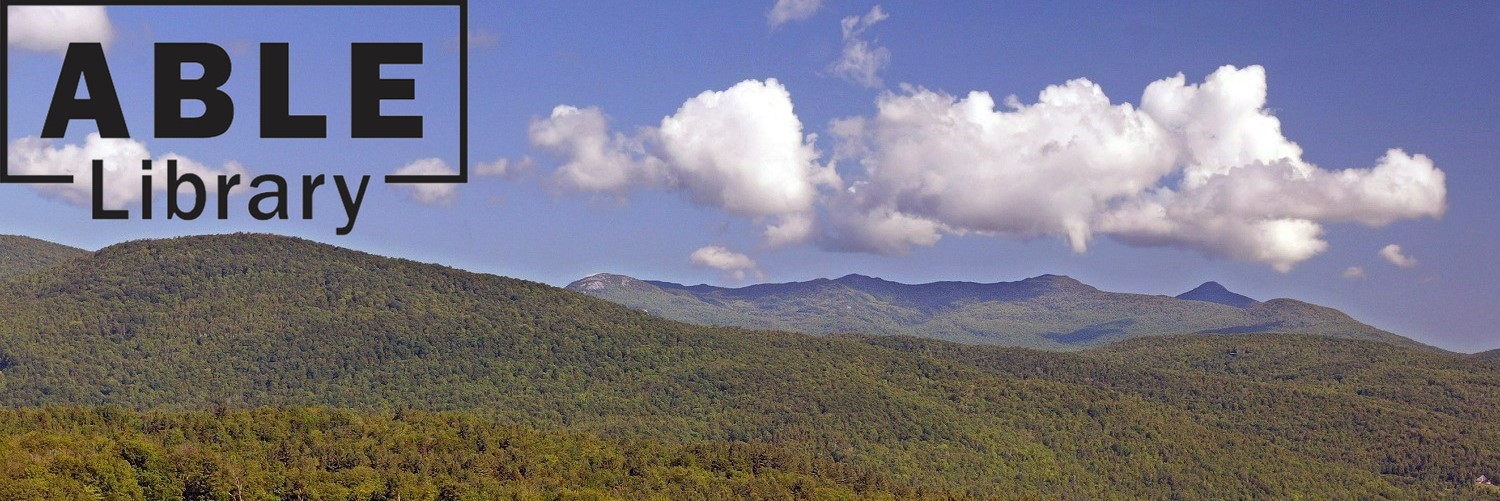 Landscape of blue sky, white clouds, and mountains covered in green trees with the ABLE Library logo